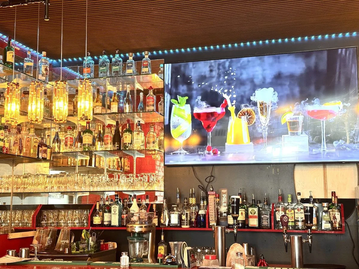CSB bar with premium bottles and cocktail screen